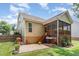 Enjoy this backyard patio with outdoor grill, mature landscaping, and screened porch access at 6 Tulip Tree Ct, Durham, NC 27712