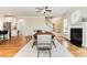 Elegant dining area featuring hardwood floors, a fireplace, and a staircase at 6 Tulip Tree Ct, Durham, NC 27712