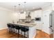 Modern kitchen with a large island, stainless steel appliances, and granite countertops at 6 Tulip Tree Ct, Durham, NC 27712