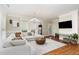 Bright living room with hardwood floors, a comfortable sectional sofa, and stylish decor at 6 Tulip Tree Ct, Durham, NC 27712