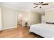 Bright main bedroom with hardwood floors, coffered ceiling, and access to the ensuite bathroom at 6 Tulip Tree Ct, Durham, NC 27712