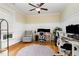 Home office with hardwood flooring, large windows and multiple work spaces at 6 Tulip Tree Ct, Durham, NC 27712