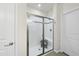Walk-in shower with bench seating and modern tile detail at 605 Smallwood Dr, Durham, NC 27703