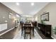 Open dining area with seating for six, seamlessly connected to the living space at 605 Smallwood Dr, Durham, NC 27703
