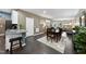 Open concept dining area with hardwood floors and seating for six people at 605 Smallwood Dr, Durham, NC 27703