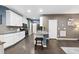 Modern kitchen with white cabinets, stainless steel appliances, and granite countertops at 605 Smallwood Dr, Durham, NC 27703