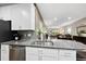 Contemporary kitchen featuring granite countertops and stainless steel dishwasher at 605 Smallwood Dr, Durham, NC 27703