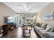 Inviting living room featuring a fireplace, ceiling fan and comfortable seating area at 605 Smallwood Dr, Durham, NC 27703