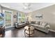 Cozy living room with hardwood floors, natural lighting, and comfortable sofas at 605 Smallwood Dr, Durham, NC 27703