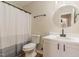 Well-lit bathroom with a white vanity, sink, and a shower with curtain at 61 Fashion Pl, Durham, NC 27705