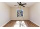 Bright, spacious bedroom with hardwood floors and a ceiling fan at 61 Fashion Pl, Durham, NC 27705