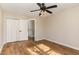 Bedroom featuring hardwood floors, a ceiling fan, and a closet at 61 Fashion Pl, Durham, NC 27705