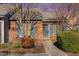 Charming brick townhome with well-maintained landscaping and blue shutters at 61 Fashion Pl, Durham, NC 27705