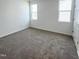 Spacious bedroom featuring plush carpeting and dual windows for natural light at 67 Furley St., Homesite 117, Sanford, NC 27330