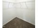 Walk-in closet with ample wire shelving and neutral carpet at 67 Furley St., Homesite 117, Sanford, NC 27330