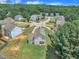 Scenic aerial view of the property amidst a neighborhood with lush greenery and well-kept lawns at 71 Herndon Ct, Clayton, NC 27520