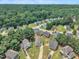 Overhead view of a charming neighborhood surrounded by mature trees and greenery at 71 Herndon Ct, Clayton, NC 27520