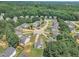 Picturesque aerial view of the neighborhood featuring homes nestled amongst lush trees and greenery at 71 Herndon Ct, Clayton, NC 27520