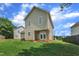 Expansive backyard featuring a well-maintained lawn and access to the home via double doors at 71 Herndon Ct, Clayton, NC 27520
