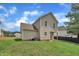 Spacious backyard and rear exterior of the home with vinyl siding and a lush green lawn at 71 Herndon Ct, Clayton, NC 27520