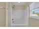 Bathroom features a bright white shower with window, modern fixtures, and neutral walls at 71 Herndon Ct, Clayton, NC 27520