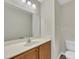 Modern bathroom featuring a mirror above the sink and a toilet at 71 Herndon Ct, Clayton, NC 27520