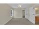Bedroom with carpet, a ceiling fan, and neutral paint; bathroom and closet entrances are nearby at 71 Herndon Ct, Clayton, NC 27520