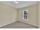 Bright bedroom with beige walls and plush carpeting at 71 Herndon Ct, Clayton, NC 27520