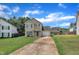 Charming two-story home with a well-manicured lawn, attached garage, and inviting curb appeal at 71 Herndon Ct, Clayton, NC 27520