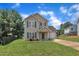Charming two-story home with a well-manicured lawn, attached garage, and inviting curb appeal at 71 Herndon Ct, Clayton, NC 27520