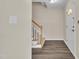 Inviting foyer with hardwood floors, staircase, and natural light creating a warm entrance at 71 Herndon Ct, Clayton, NC 27520