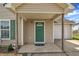 Welcoming front porch with a vibrant green door and a cozy entrance to the home at 71 Herndon Ct, Clayton, NC 27520