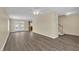 Spacious living room featuring hardwood floors, neutral walls, and a staircase to the upper level at 71 Herndon Ct, Clayton, NC 27520