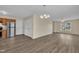Open concept living room connected to kitchen with hardwood floors and neutral wall color at 71 Herndon Ct, Clayton, NC 27520