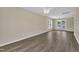 Bright living room with hardwood floors, neutral walls, and natural light from large windows at 71 Herndon Ct, Clayton, NC 27520