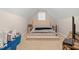 Charming bedroom featuring a tufted platform bed, neutral tones, and a cozy, inviting atmosphere at 7107 Elkhorn Rd, Rocky Mount, NC 27803