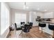 Sunlit breakfast nook featuring a glass table and counter seating by the kitchen at 7107 Elkhorn Rd, Rocky Mount, NC 27803