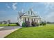 Traditional two-story brick home with an attached two car garage on a large grassy lot at 7107 Elkhorn Rd, Rocky Mount, NC 27803