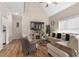 Bright living room featuring vaulted ceiling, wood floors, and comfortable seating at 7107 Elkhorn Rd, Rocky Mount, NC 27803