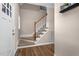 Inviting carpeted staircase with white railings and wood accents leading to the upper level at 7107 Elkhorn Rd, Rocky Mount, NC 27803
