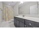 Bathroom with vanity and decorative shower curtain at 7410 Chouder Ln, Wake Forest, NC 27587