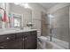 Clean bathroom with marble countertops and tile shower at 7410 Chouder Ln, Wake Forest, NC 27587