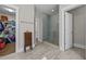 Bathroom featuring glass shower, tile floors and access to walk in closet at 7410 Chouder Ln, Wake Forest, NC 27587