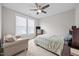 Bedroom with ceiling fan, window and comfortable seating area at 7410 Chouder Ln, Wake Forest, NC 27587