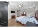 Spacious bedroom features tray ceilings, wood floors and media center at 7410 Chouder Ln, Wake Forest, NC 27587