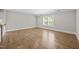 Spacious empty room with hardwood floors and bright natural light at 7410 Chouder Ln, Wake Forest, NC 27587