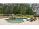 A resort-style pool with a basketball hoop and a stone-clad hot tub offers backyard fun and relaxation at 7410 Chouder Ln, Wake Forest, NC 27587