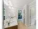 Bathroom features double sink vanity, tile flooring, and view to bedroom at 776 Legend Oaks Dr, Chapel Hill, NC 27517