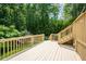 Large wooden deck offering peaceful views of the lush, tree-filled backyard at 776 Legend Oaks Dr, Chapel Hill, NC 27517