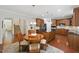 Open kitchen featuring stainless steel appliances, island and adjacent to the dining area at 776 Legend Oaks Dr, Chapel Hill, NC 27517